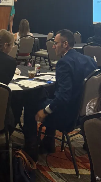 Sarah Vick and Joe Sweigart discuss at the event table