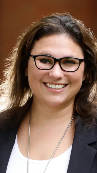 Headshot of Elizabeth Rhodus wearing white shirt and black jacket