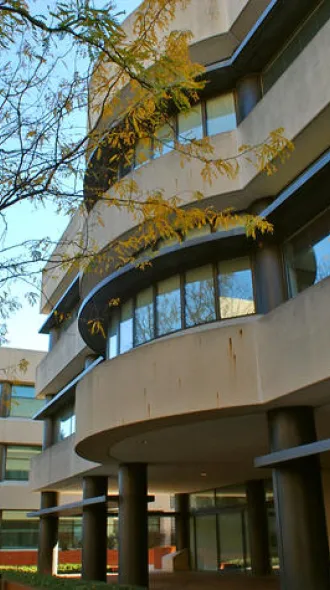 A view of the entrance to the cancer center on a clear, autumn day.